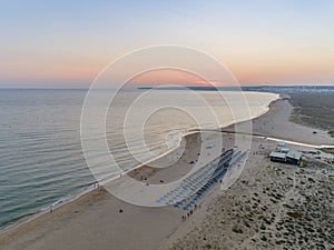 Aerial dusk seascape of Salgados beach in Albufeira, Algarve.