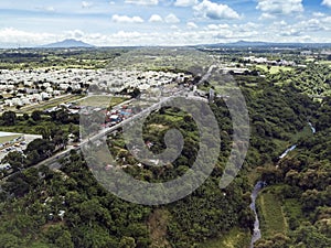 Aerial of Emilio Aguinaldo Highway and a nearby river in Dasmarinas Cavite. View of road that goes straight to Tagaytay photo