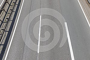 Aerial of empty highway with road markings photo