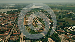 Aerial establishing shot of the city of Mantova involving former hippodrome park, Italy