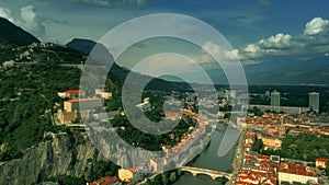 Aerial iconic shot of historic part of Grenoble involving famous Telepherique, a ropeway to Bastille Fort, France photo