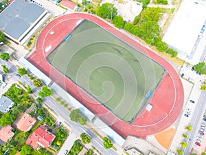 Aerial Establishing Shot of a Whole Stadium with Soccer Championship Match. Teams Play, Crowd of Fans Cheer. Football Tournament,
