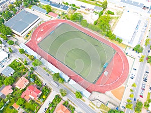 Aerial Establishing Shot of a Whole Stadium with Soccer Championship Match. Teams Play, Crowd of Fans Cheer. Football Tournament,