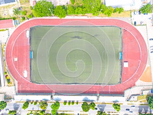 Aerial Establishing Shot of a Whole Stadium with Soccer Championship Match. Teams Play, Crowd of Fans Cheer. Football Tournament,