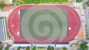 Aerial Establishing Shot of a Whole Stadium with Soccer Championship Match. Teams Play, Crowd of Fans Cheer. Football Tournament,