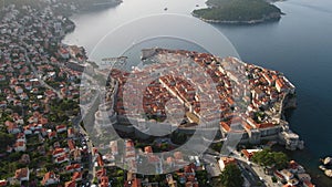 Aerial establishing view of old town of Dubrovnik with island on Adriatic sea, Dalmatia, Croatia. Medieval city fortress