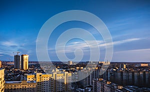 Aerial evening cityscape from rooftop of Voronezh. Houses, sunset, sky, clouds,