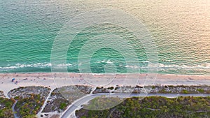 Aerial evening seascape with Blind Pass sandy beach on Manasota Key, USA. Many tourists enjoying summer vacation time