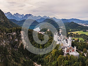 Aerial of the famous Neuschwanstein fairy tale castle in majestic mountain landscape in Bavaria, Germany