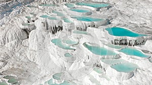 Aerial of the famous Pamukkale travertines in central western turkey. Famous for their turquoise thermal pools and pure white