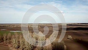 Aerial fields in early spring. Aerial shot of fields with various types of agriculture early spring