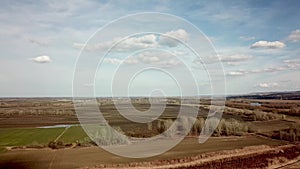 Aerial fields in early spring. Aerial shot of fields with various types of agriculture early spring