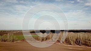 Aerial fields in early spring. Aerial shot of fields with various types of agriculture early spring