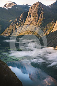 Aerial fjord view in Norway mountains landscape morning clouds above water explore Sunnmore Alps