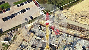 Aerial Flight Over a New Constructions Development Site with High Tower Cranes Building Real Estate. Heavy Machinery and