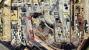 Aerial Flight Over a New Constructions Development Site with High Tower Cranes Building Real Estate. Heavy Machinery and