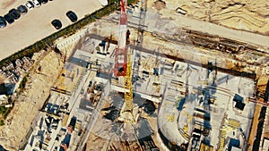 Aerial Flight Over a New Constructions Development Site with High Tower Cranes Building Real Estate. Heavy Machinery and