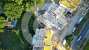 Aerial Flight Over a New Constructions Development Site. Urban Construction Site, Aerial View. High crane works on building site.