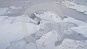 Aerial flight over polar ocean, base. Antarctica.