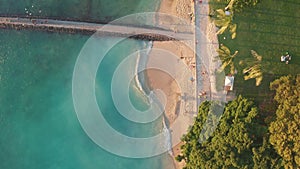 Aerial flight over a tropical beach. Cinematic video shooting. Aerial drone slowly flying over colorful landscape during