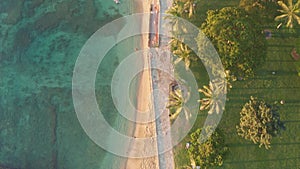 Aerial flight over a tropical beach. Cinematic video shooting. Aerial drone slowly flying over colorful landscape during