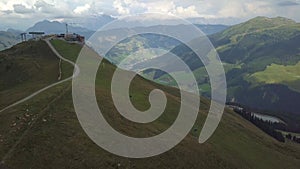 Aerial flight from Zwoelferkogel mountain station in Hinterglemm/Saalbach Austria, with construction works for a new