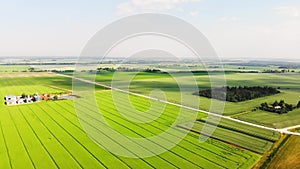 Aerial fly over scenic scenic agricultural farming fields in countryside