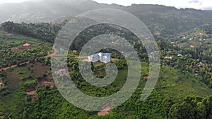 Aerial flyby shot of Lushoto town based in lush mountain tropical forest in Tanga Region of Tanzania, Remote calm