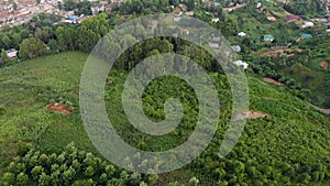 Aerial flyby shot of Lushoto town based in lush mountain tropical forest in Tanga Region of Tanzania, Remote calm