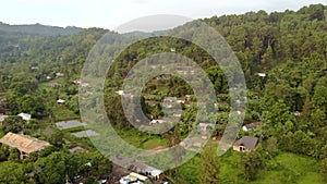 Aerial Flyby Shot of Lushoto Town based in Lush Mountain Tropical Forest in Tanga Region of Tanzania, Remote calm