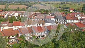 AERIAL: Flying above the quiet suburban townhouses on a sunny summer afternoon.