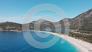 Aerial flying Oludeniz beach and lagoon Beautiful bay, crystal blue water Turkey