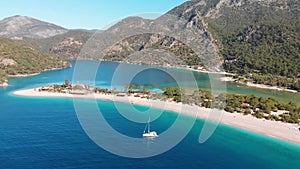 Aerial flying Oludeniz beach and lagoon Beautiful bay, crystal blue water Turkey