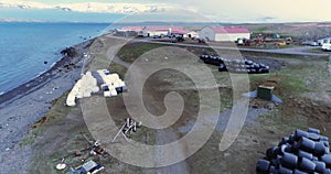 Aerial flying over coastal farm in Arkogssandur, Iceland