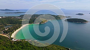 Aerial flying pass cliff to reveal beautiful beach of Phuket, Thailand