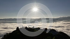 Aerial flying pass Gunungsilipat hill to reveal the sea of mist, Yala, Thailand