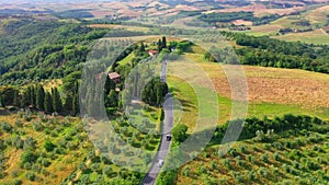 Aerial flyover the beautiful sunset landscape in Tuscany, Italy.