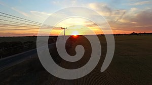 Aerial flyover of field at sunset, Australia Outback