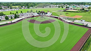 Aerial Flyover of Suburban Indiana Ballpark with Crowded Parking