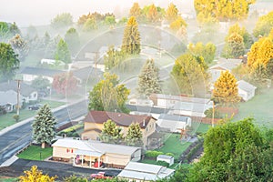 Aerial foggy landscape of small town USA in countryside Colfax, Eastern Washington