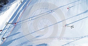 Aerial - follow shot of alpine skier skiing down