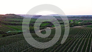 Aerial footage of an agricultural area and green rolling fields.