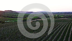 Aerial footage of an agricultural area and green rolling fields.