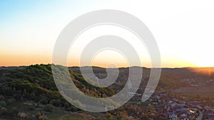 Aerial footage of an agricultural area and green rolling fields.