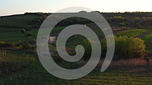 Aerial footage of an agricultural area and green rolling fields.