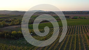 Aerial footage of an agricultural area and green rolling fields.