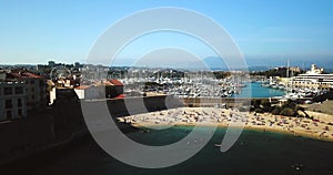 Aerial footage of Antibes, France, Cote D Azur. Beautiful sunny day in Mediterranean Sea. Old castle and sea. Roofs and