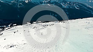 Aerial footage of Blackcomb mountain and skiers on a sunny day.