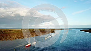 Aerial footage of boats at anchorage in the river