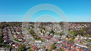 Aerial footage of the British town of Meanwood in Leeds West Yorkshire showing typical UK housing estates and rows of houses from